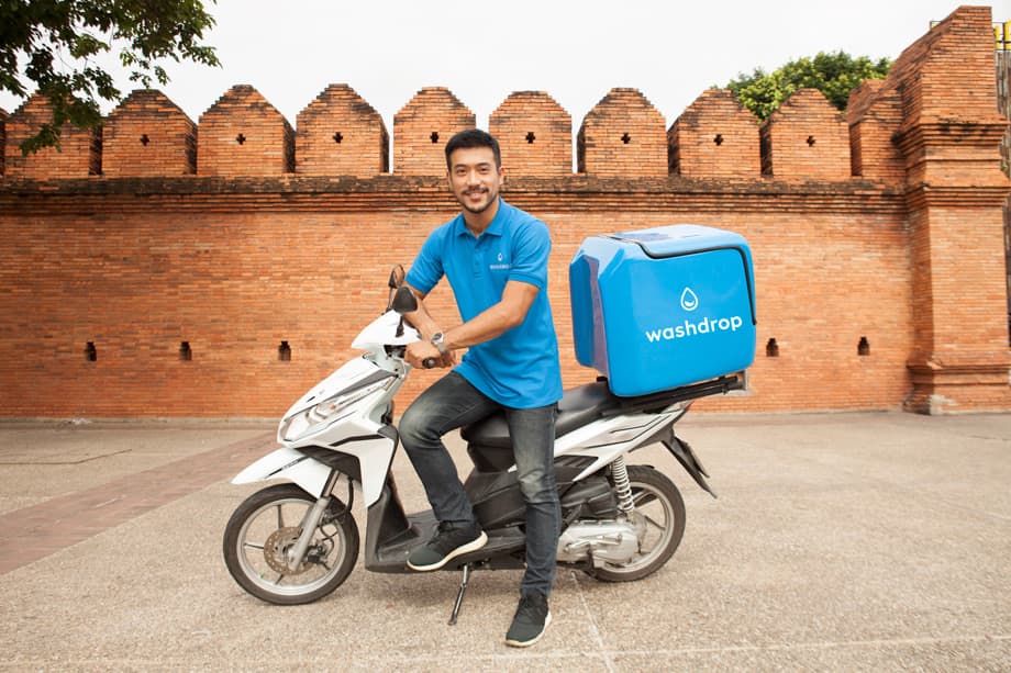 WashDrop's laundry delivery bike at Thapae Gate, Chiang Mai